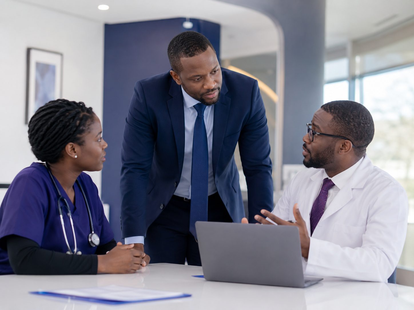 Hospital leadership consulting with a clinician